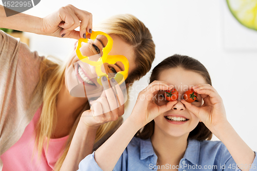 Image of happy family cooking and having fun at kitchen