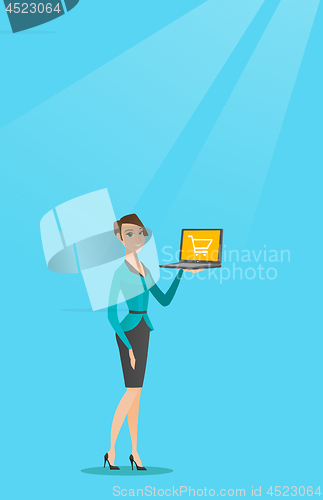Image of Woman holding laptop with trolley on a screen.