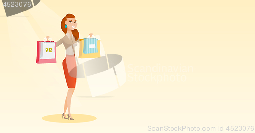 Image of Young caucasian woman holding shopping bags.