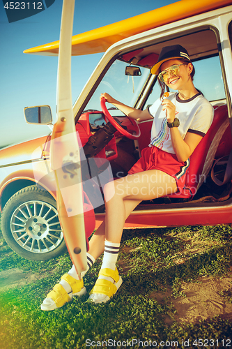 Image of Woman and happy trip by car