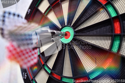 Image of Darts arrow hitting in the target center