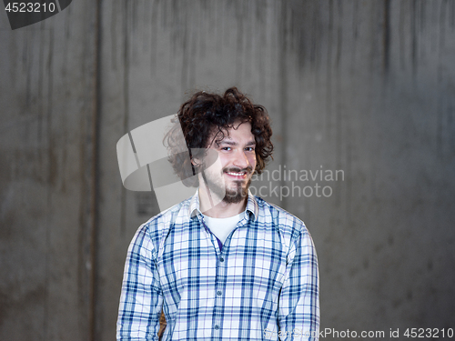 Image of portrait of young male architect on construction site