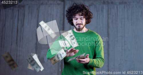 Image of businessman making the rain of money