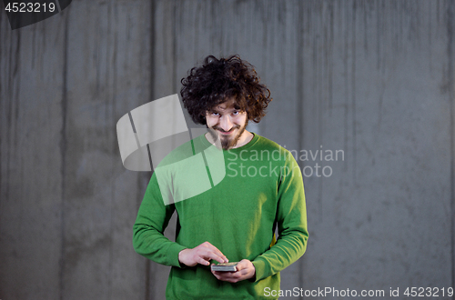 Image of business man displaying a spread of american dollar cash money