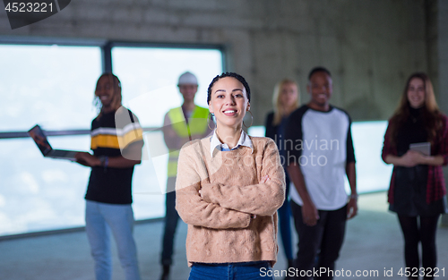 Image of young businesswoman on construction site