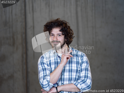 Image of portrait of young male architect on construction site