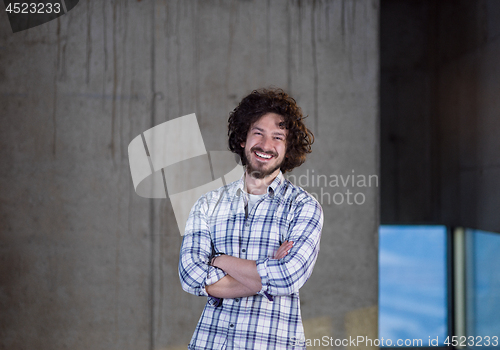 Image of portrait of young male architect on construction site