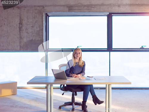 Image of young female architect on construction site