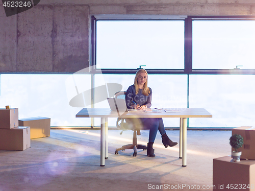 Image of young female architect on construction site