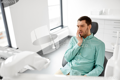 Image of patient suffering from toothache at dental clinic