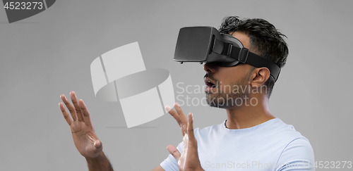 Image of man in virtual reality headset or vr glasses