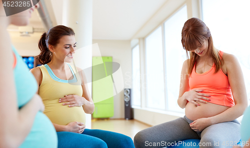 Image of pregnant women sitting on exercise balls in gym