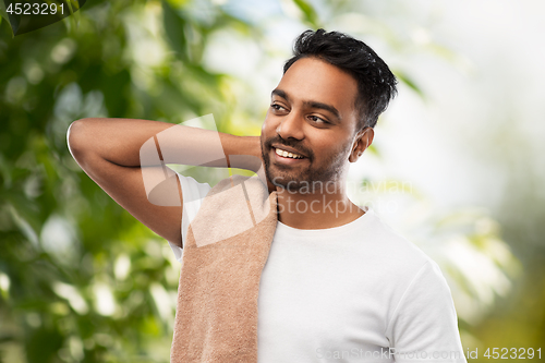 Image of indian man with towel over natural background