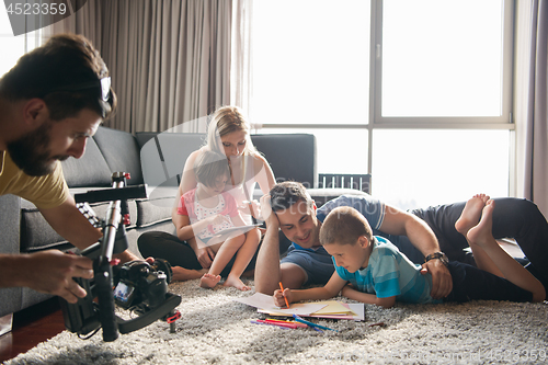 Image of young couple spending time with kids