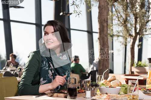 Image of young woman at a restaurant