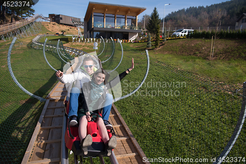 Image of couple enjoys driving on alpine coaster