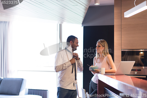 Image of A young couple is preparing for a job and using a laptop