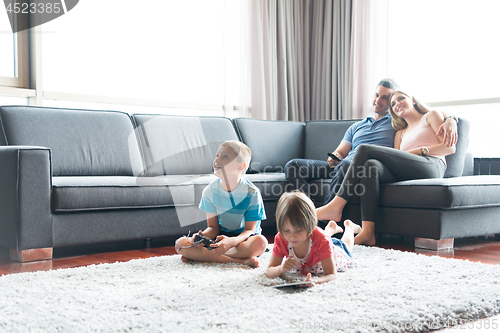Image of couple spending time with kids