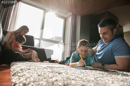 Image of young couple spending time with kids