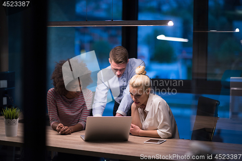 Image of Multiethnic startup business team in night office