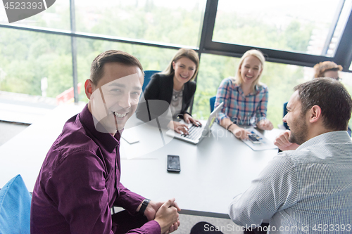 Image of Group of young people meeting in startup office