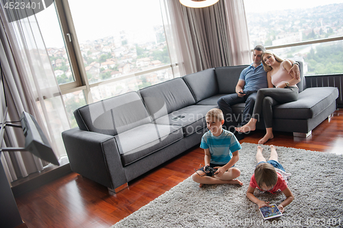 Image of couple spending time with kids