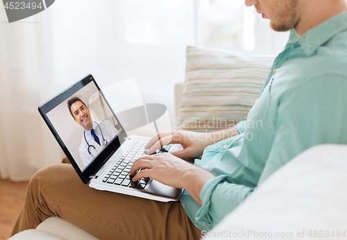 Image of patient having video call with doctor on laptop