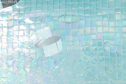 Image of turquoise water in tiled swimming pool