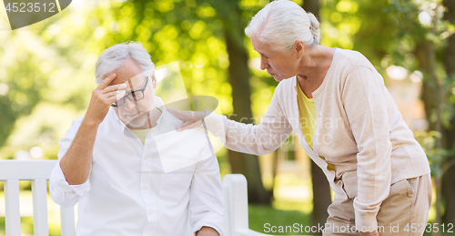 Image of senior man suffering from headache outdoors