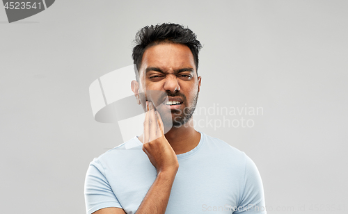 Image of indian man suffering from toothache