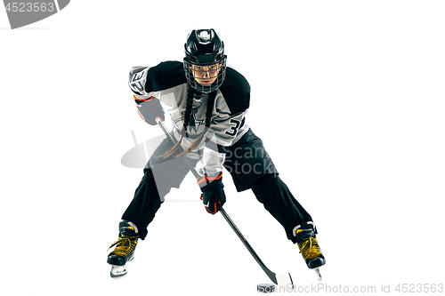 Image of Young female hockey player with the stick isolated on white background