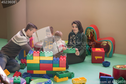 Image of parents having fun with kids