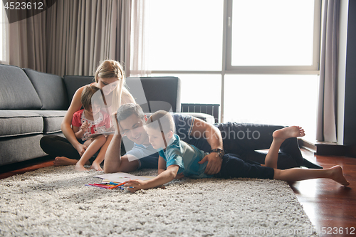 Image of young couple spending time with kids