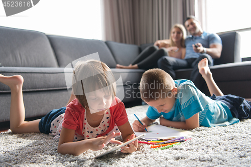 Image of young couple spending time with kids