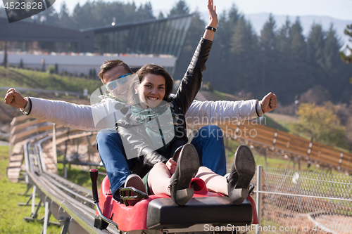 Image of couple enjoys driving on alpine coaster