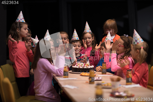 Image of The young boy joyfully celebrating his birthday