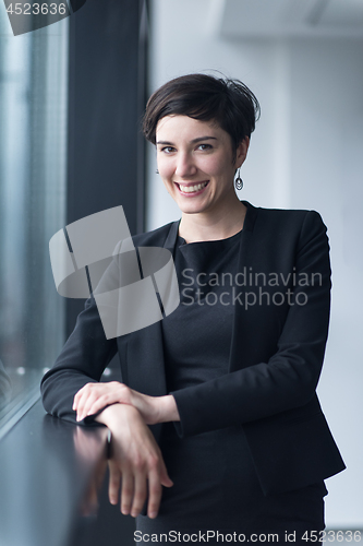 Image of Portrait of successful Businesswoman by the window