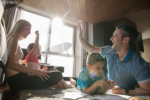 Image of young couple spending time with kids