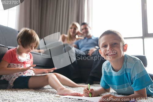 Image of young couple spending time with kids