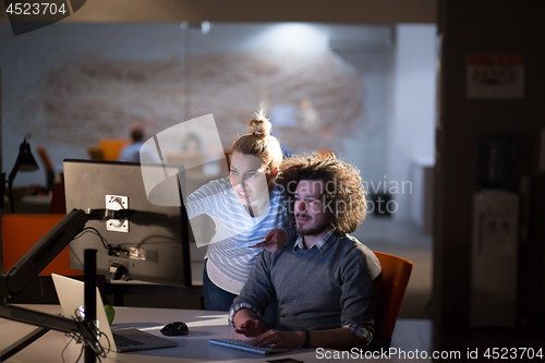 Image of young designers in the night office