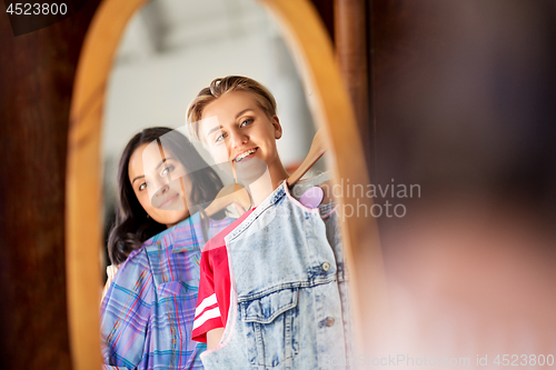 Image of women choosing clothes at vintage clothing store