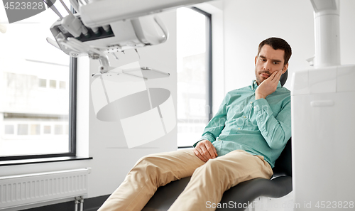 Image of patient suffering from toothache at dental clinic