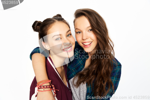 Image of happy smiling pretty teenage girls hugging