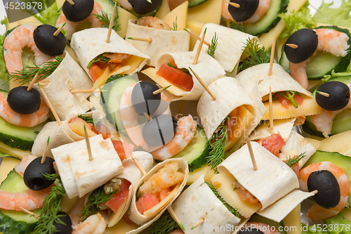 Image of Konope snack on skewers, salad, cheese, shrimp and olive