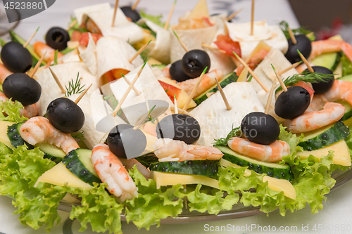 Image of Konope snack on skewers, salad, cheese, shrimp and olive