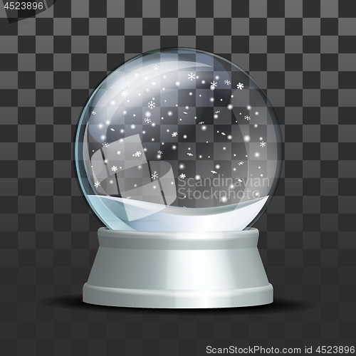 Image of Snow globe with falling snowflakes.