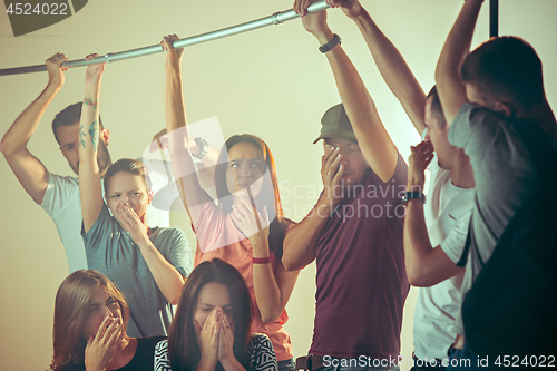 Image of Sweaty armpits. Sweaty man. Bus. Public transport. The unhappy people near man