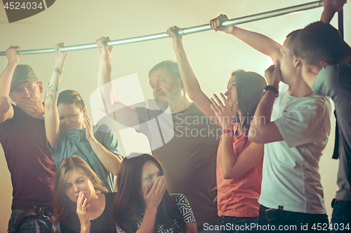 Image of Sweaty armpits. Sweaty man. Bus. Public transport. The unhappy people near man