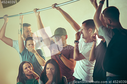 Image of Sweaty armpits. Sweaty man. Bus. Public transport. The unhappy people near man