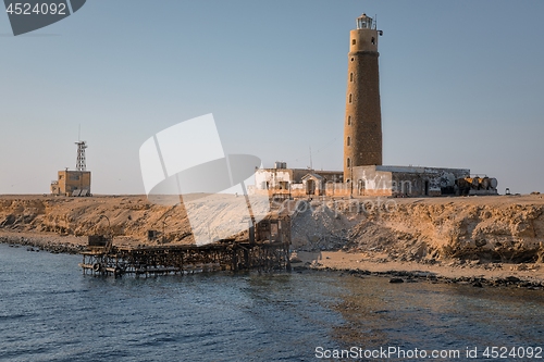 Image of Tall lighthouse on the sea